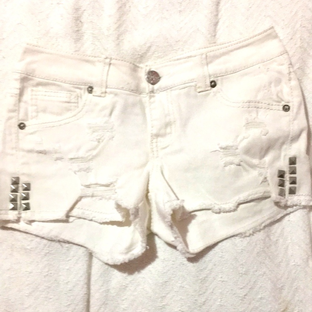 White ripped shorts
